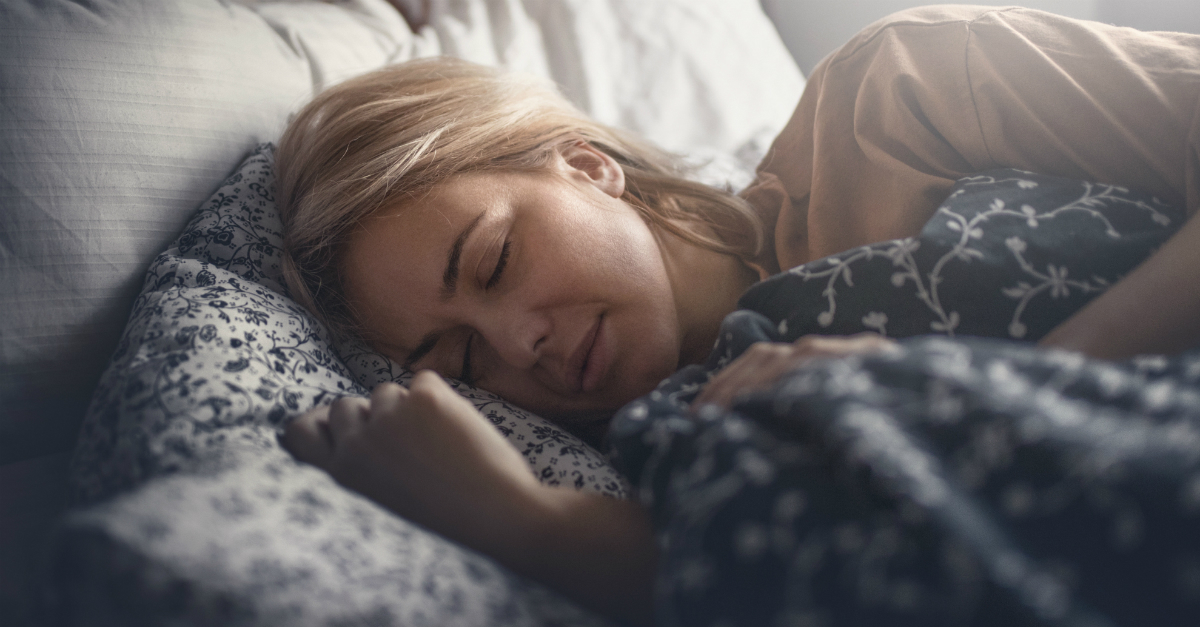 Woman lying in bed asleep