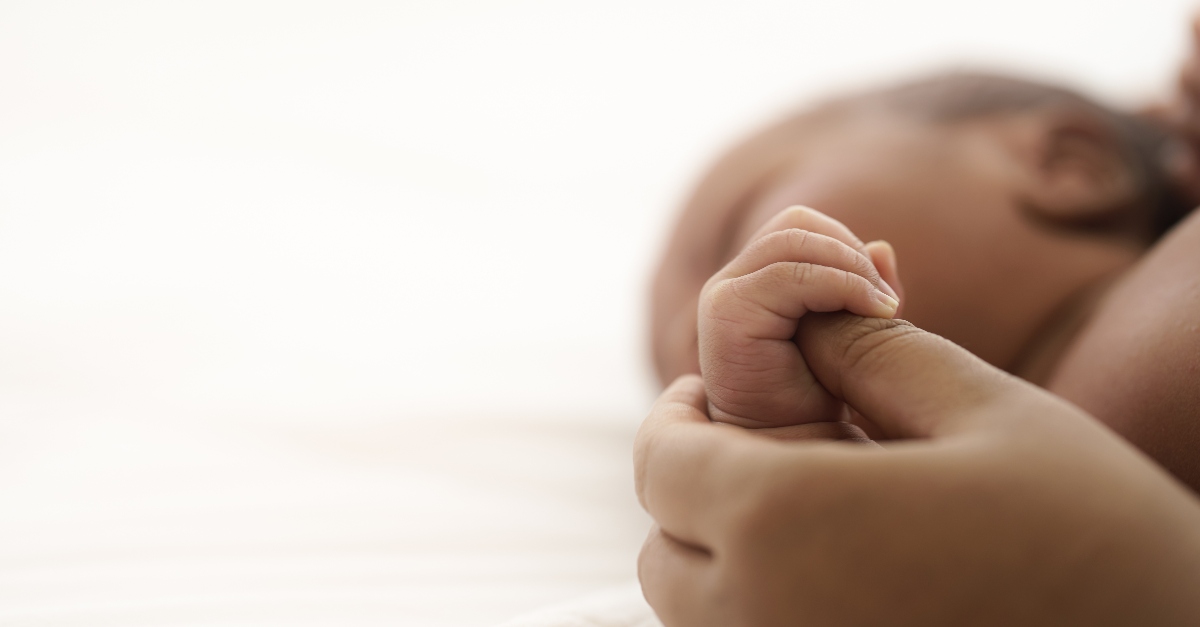 Baby holding a mothers hand