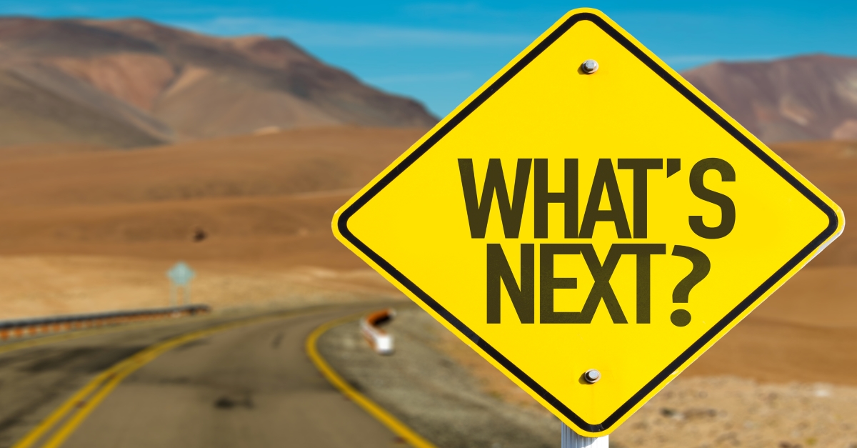 road sign saying "what next?"