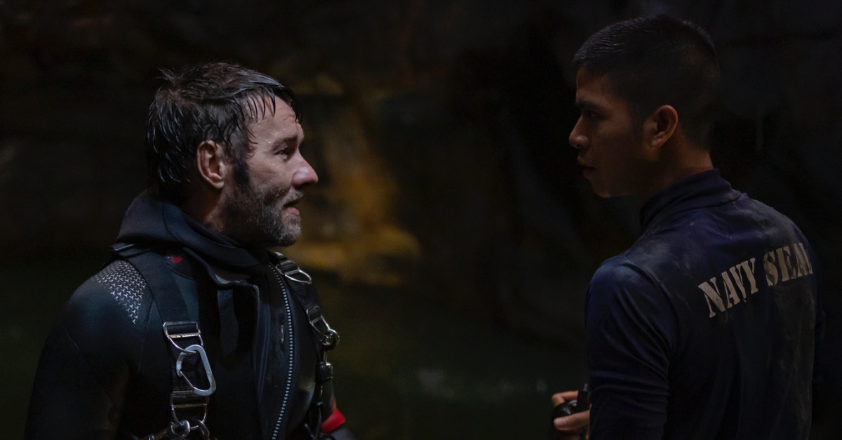 the diver and coach in the cave