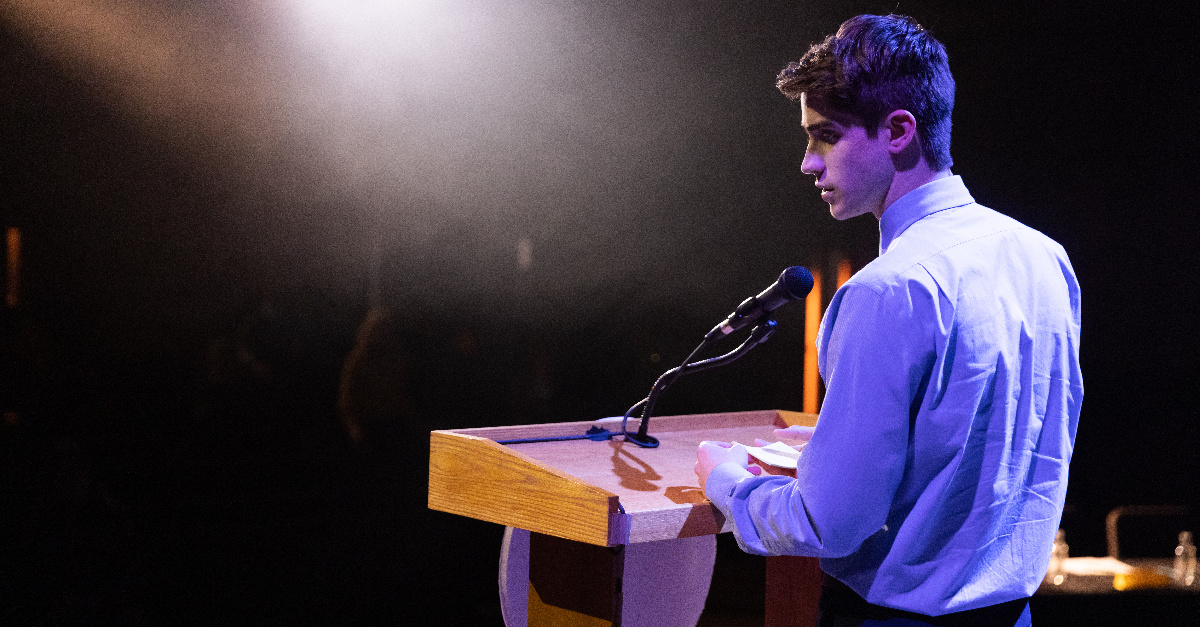 David speaking to a crowd about adoption