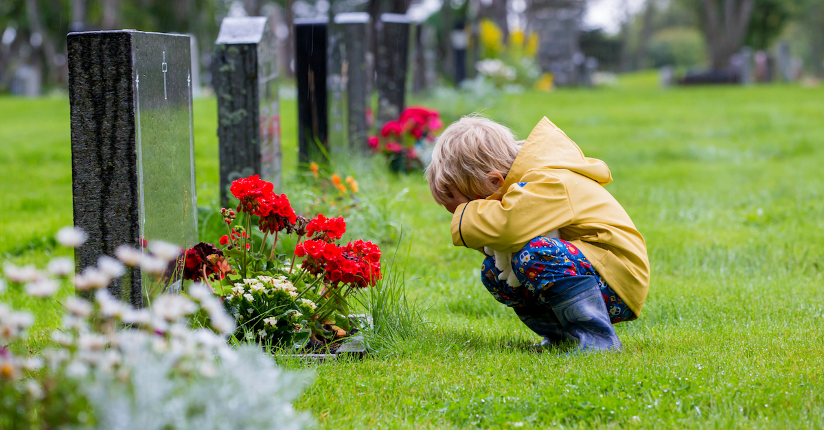 Little boy grief death at funeral