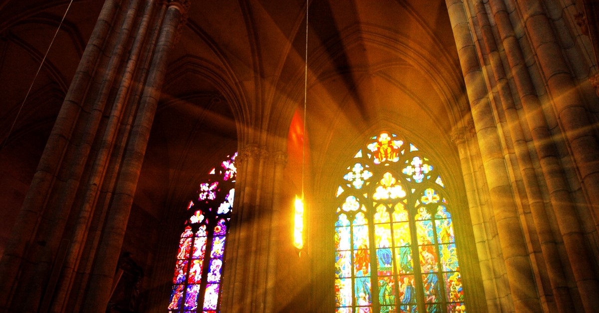 cathedral with light shining through stained glass window, christian art