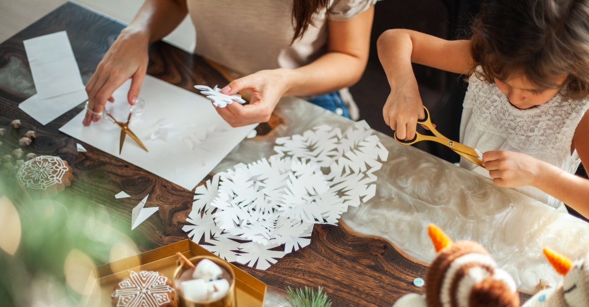 Mother and daughter making Christmas crafts