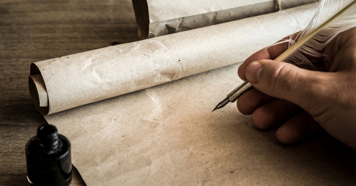 Man writing on scroll