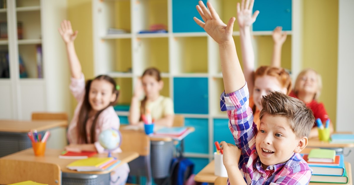 children raising hands in classroom, christian jokes