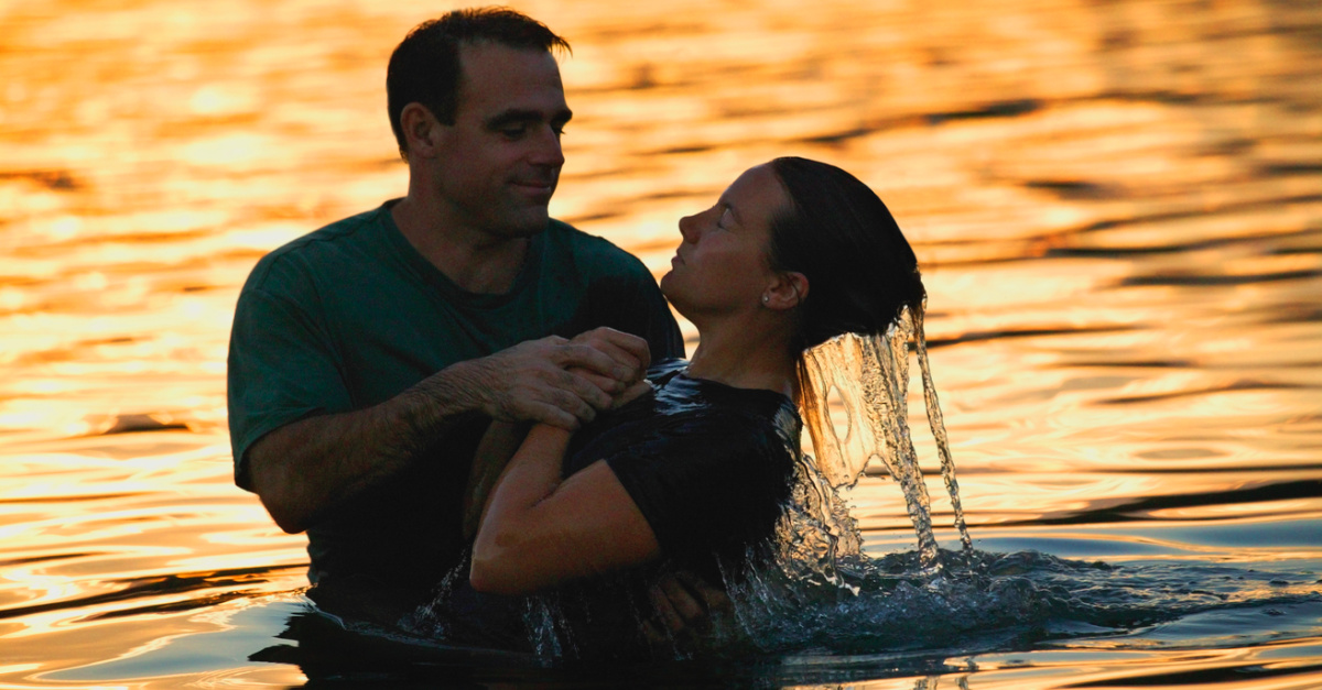 a person being baptized, churches and ministries report an increase in baptisms