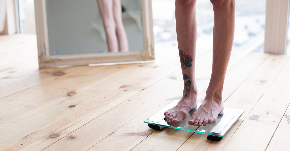 Teen in front of mirror negative body image weight eating disorder