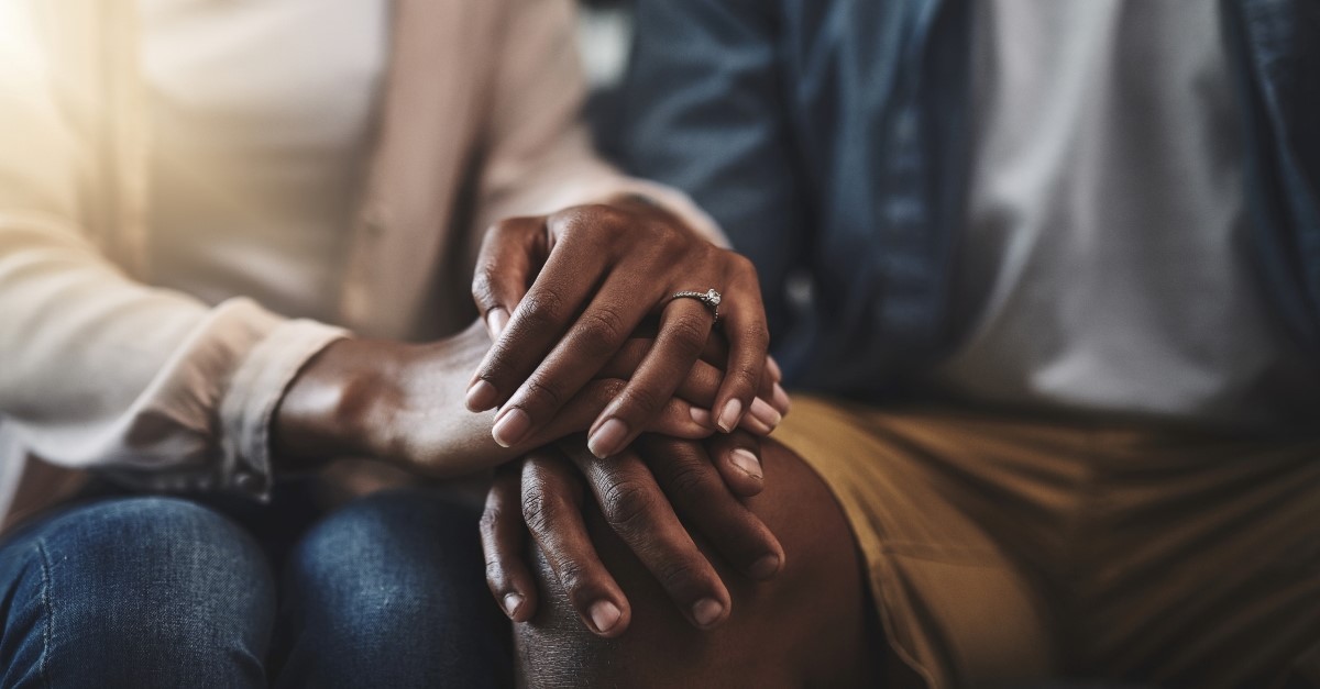 married couple holding hands, what does submissive mean