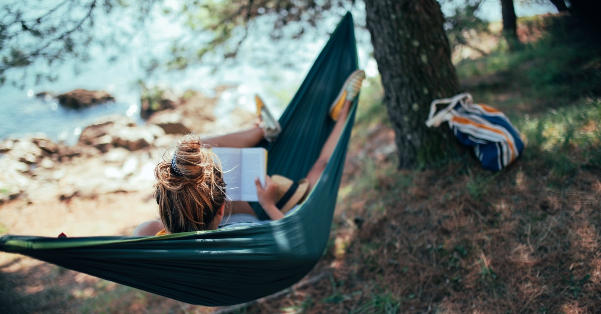 Woman reading in a hammock