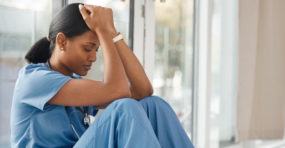 stressed african-american nurse, prayer for healthcare workers
