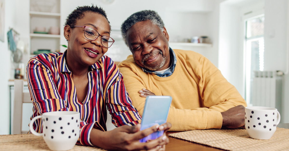 Senior couple happy on phone