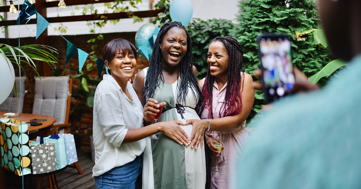 Pregnant woman with friends celebration at baby shower