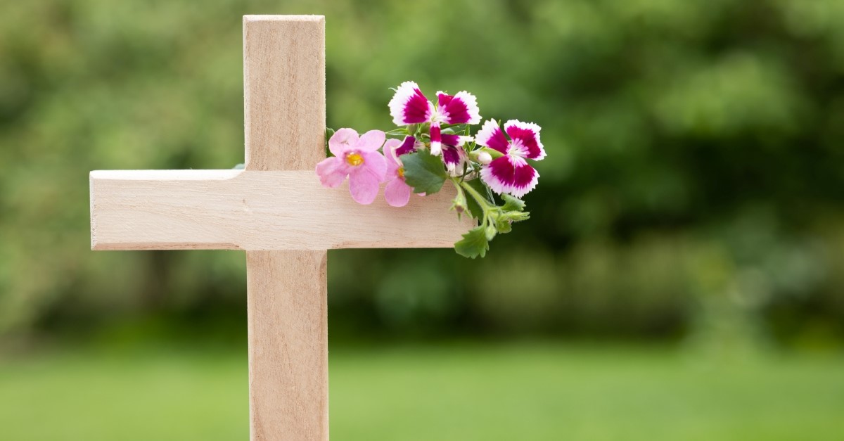 cross with flower to illustrate seventh-day adventist beliefs about death