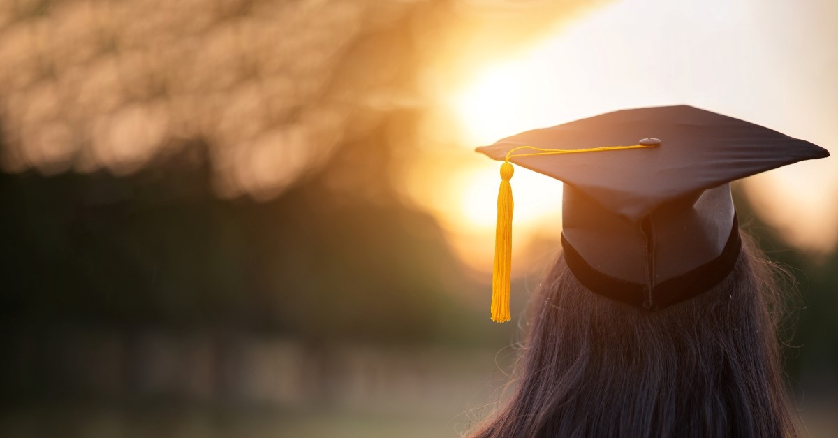 woman with graduation hat looking at horizon, prayer for graduate