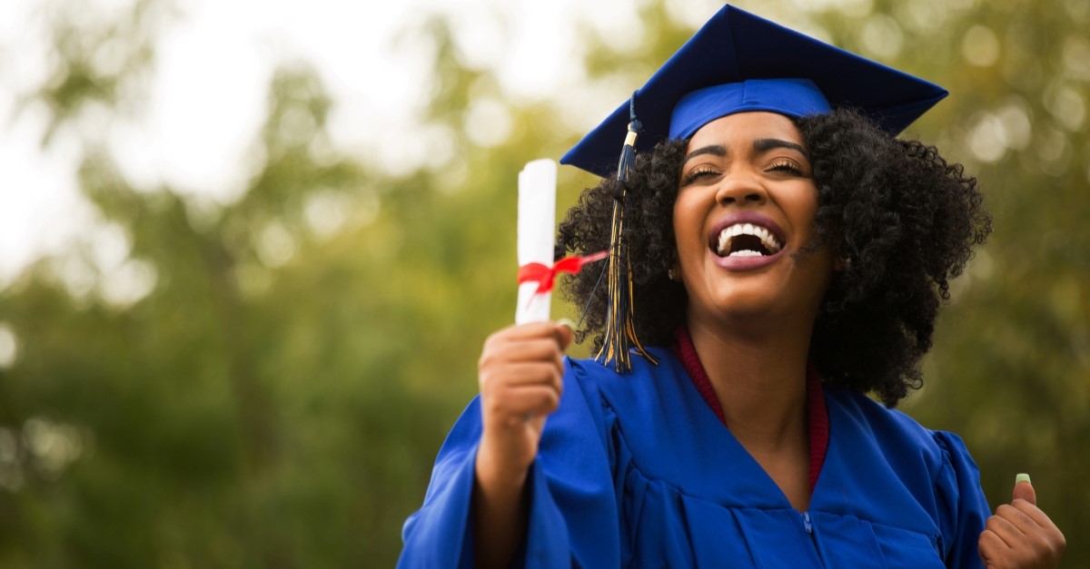happy african-american woman graduating from college, prayer for graduate