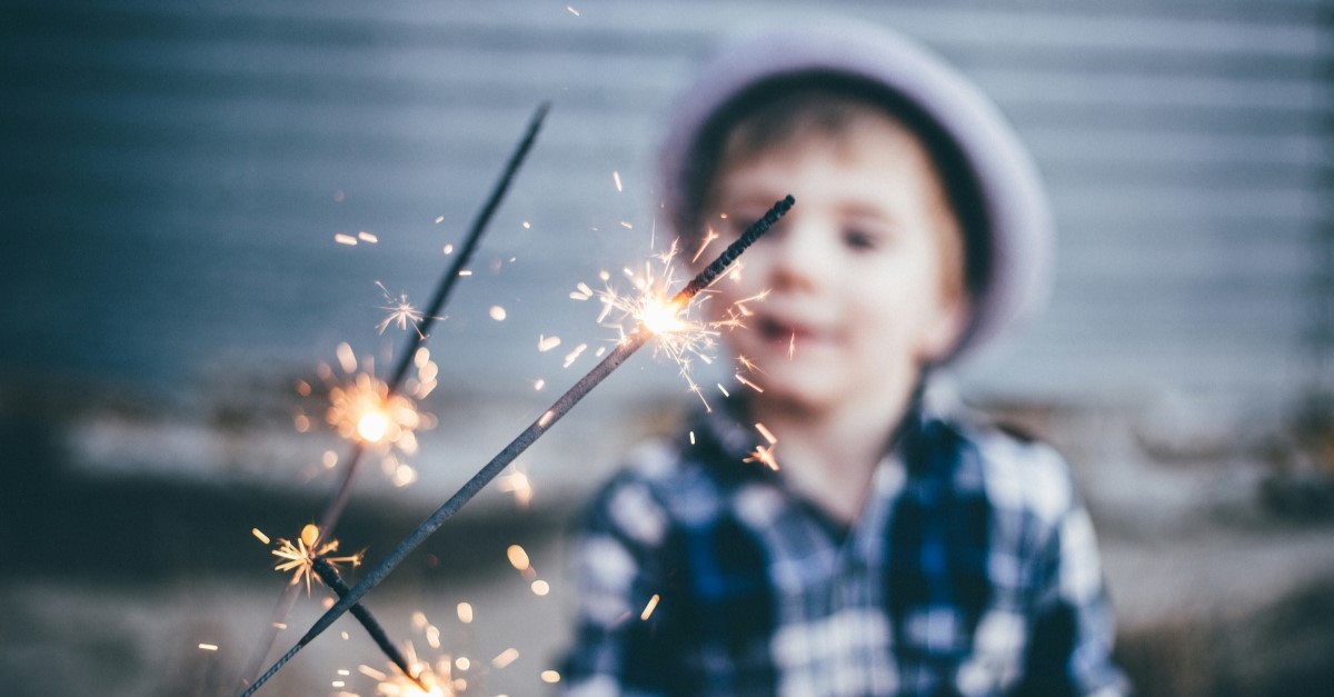 child playing with sparkler