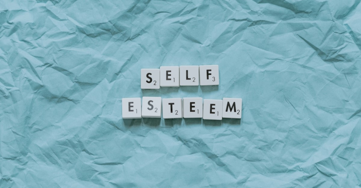 scrabble tiles spelling out "self esteem," christian love quotes