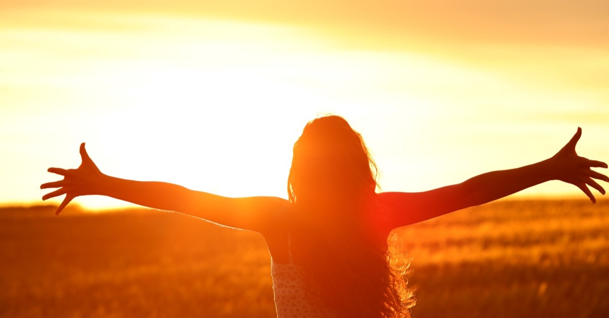 woman worshipping god outside bright sunlit background, prayer verses gratitude