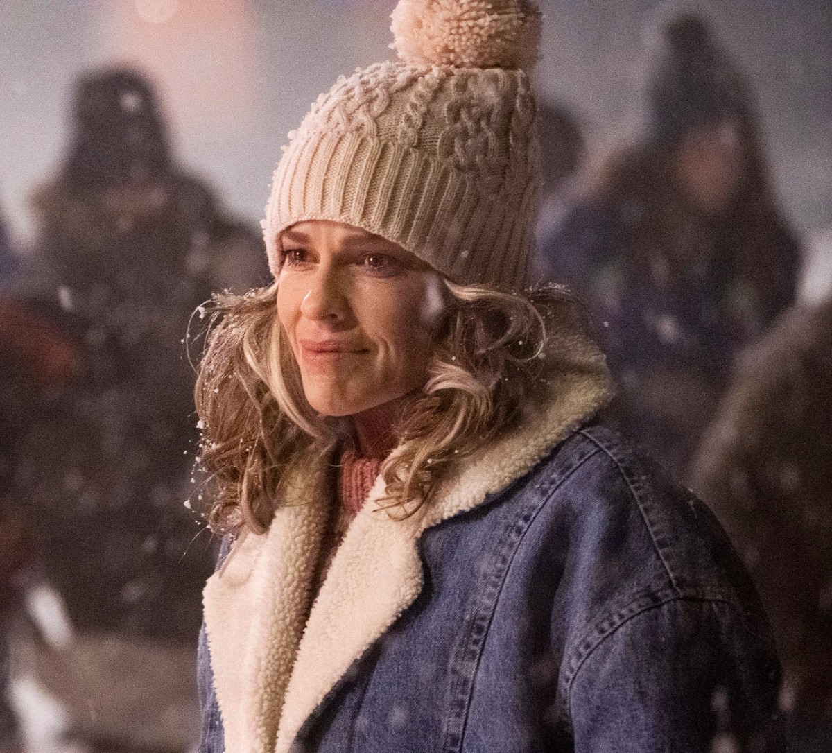 One of the stars of the movie Ordinary Angels smiles in winter gear