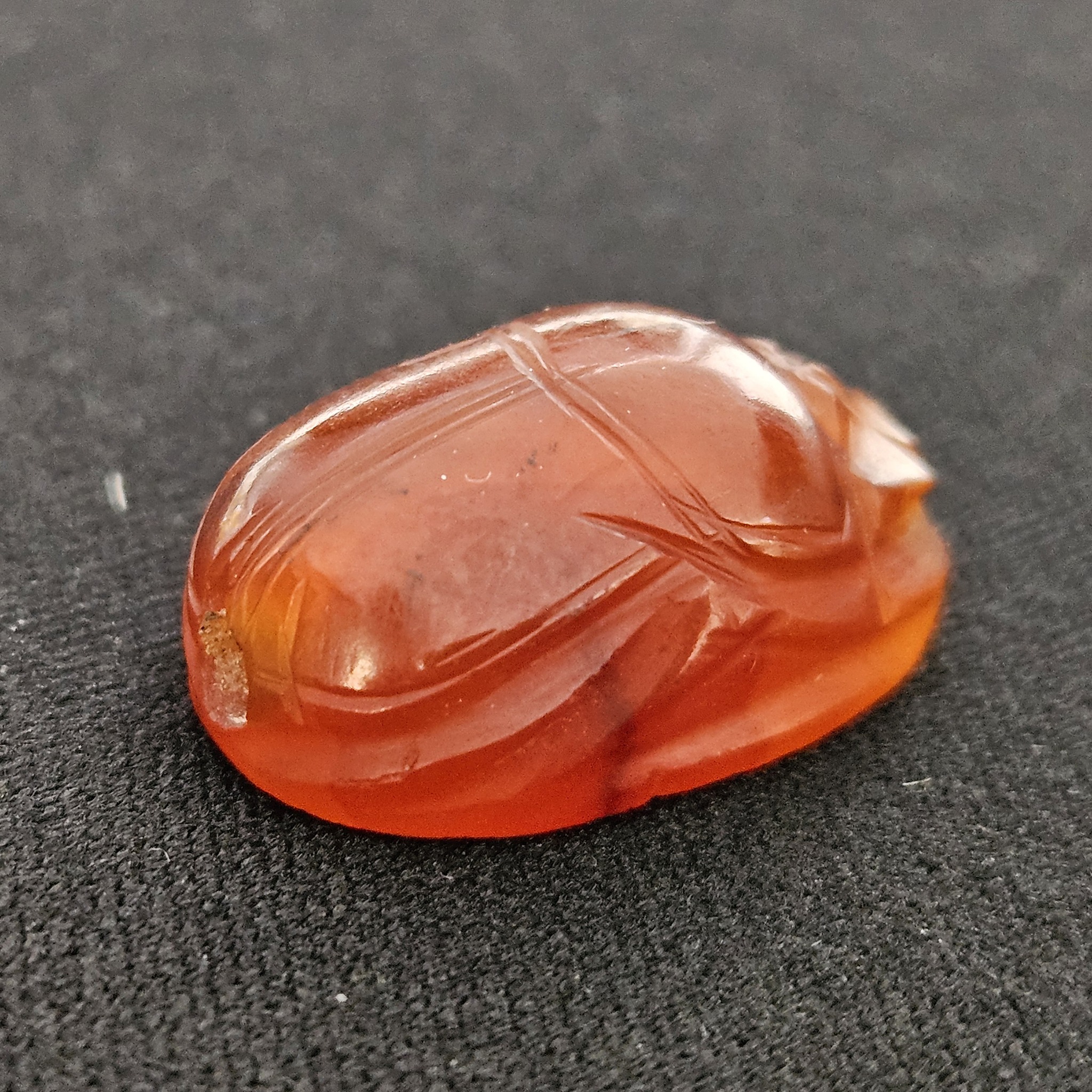 An ancient orange seal of Solomon shaped like a scarab beetle