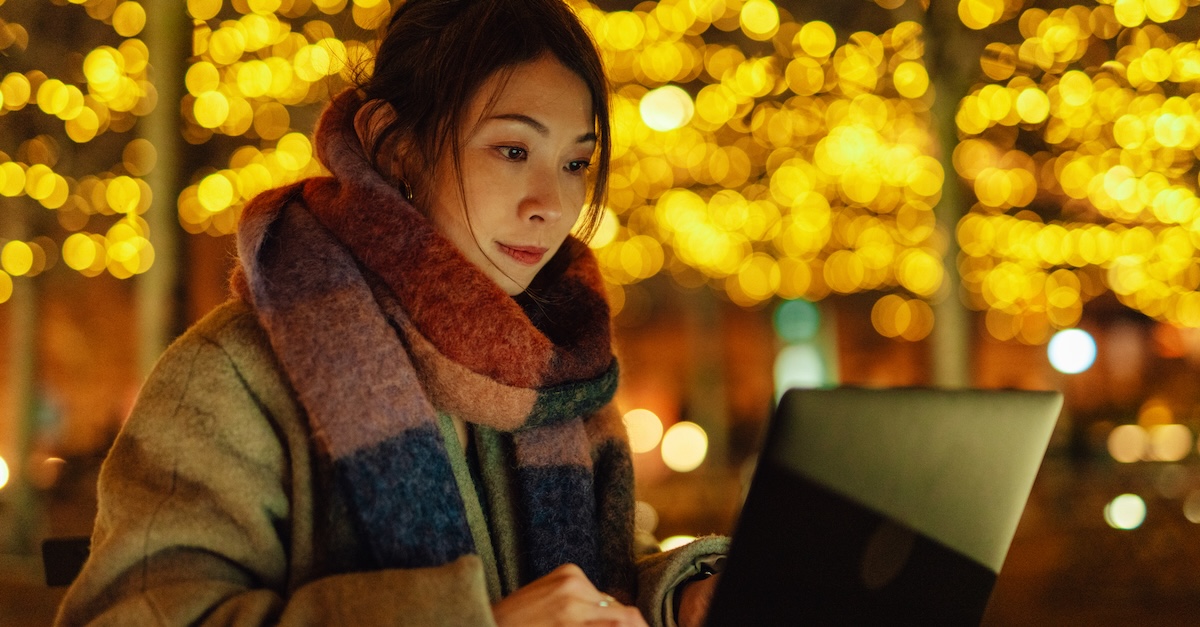 Woman working on laptop Christmas holidays