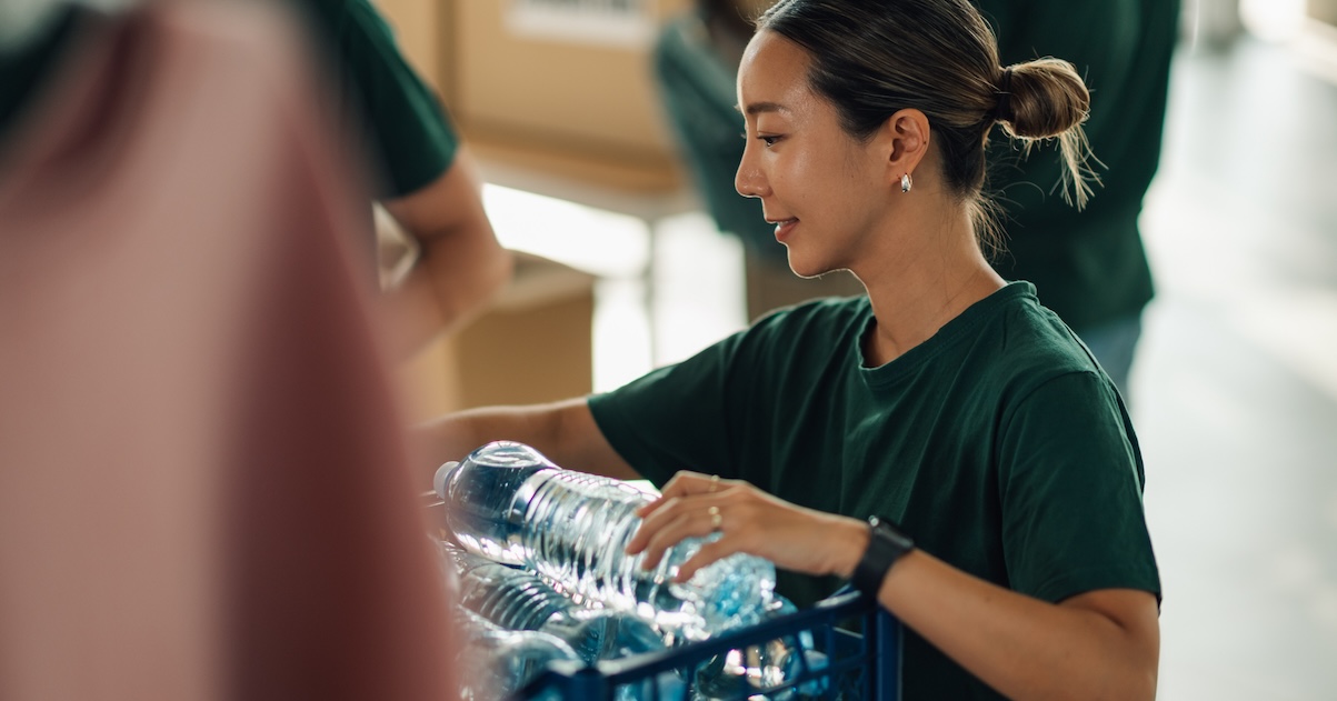 Single woman in ministry volunteer serving water