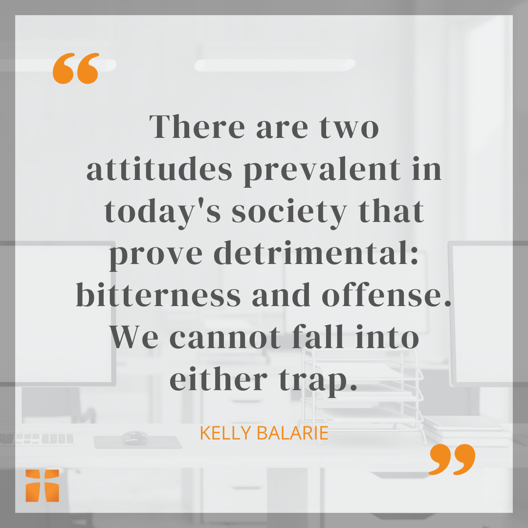 Inspirational quote graphic with a faded office workspace background and text by Kelly Balarie about avoiding bitterness and offense in today’s society.