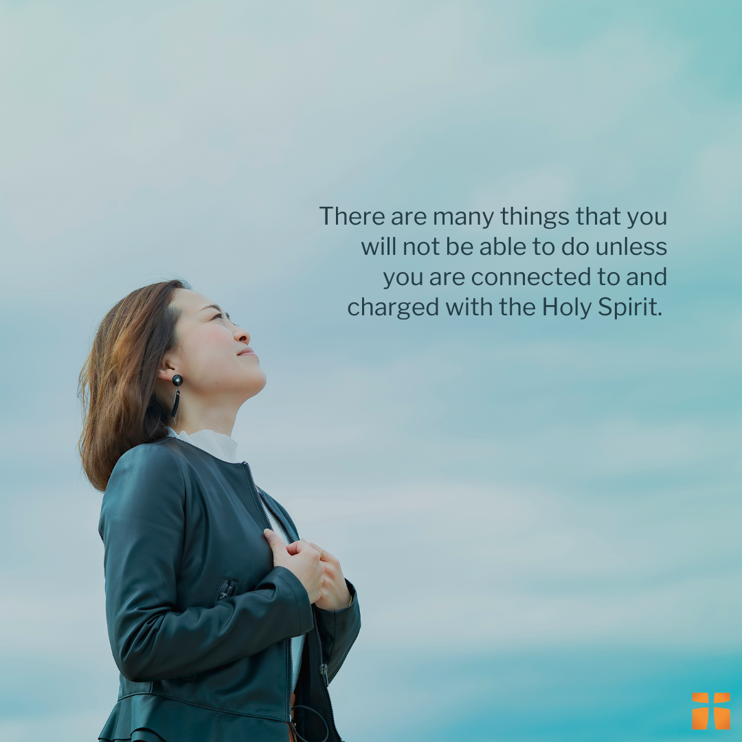 Quote graphic featuring the statement, “There are many things that you will not be able to do unless you are connected to and charged with the Holy Spirit,” displayed beside a woman looking upward in prayerful reflection against a cloudy sky background.